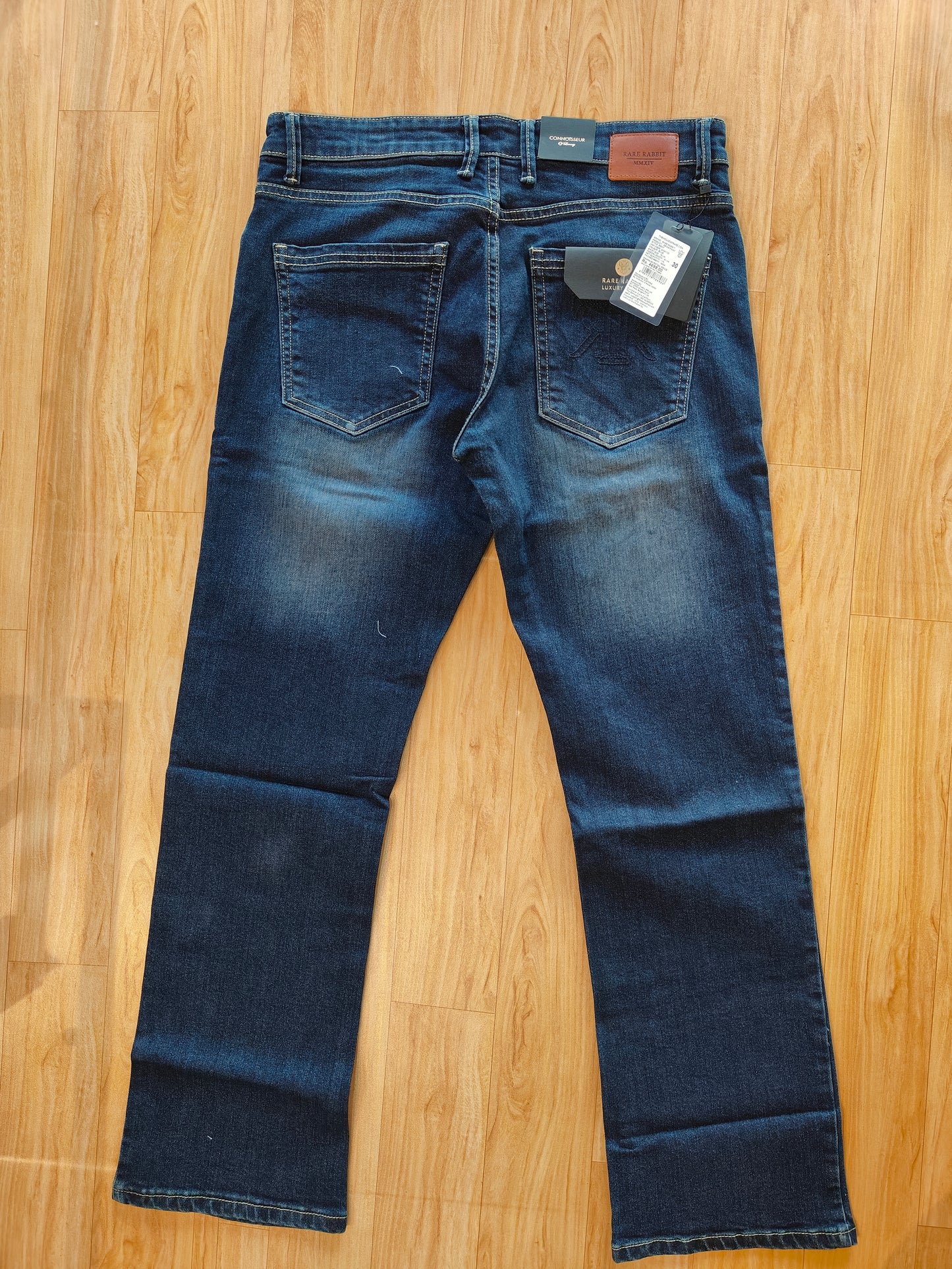 Rare Rabbit Men’s Mid-Wash Denim Jeans (Blue)
